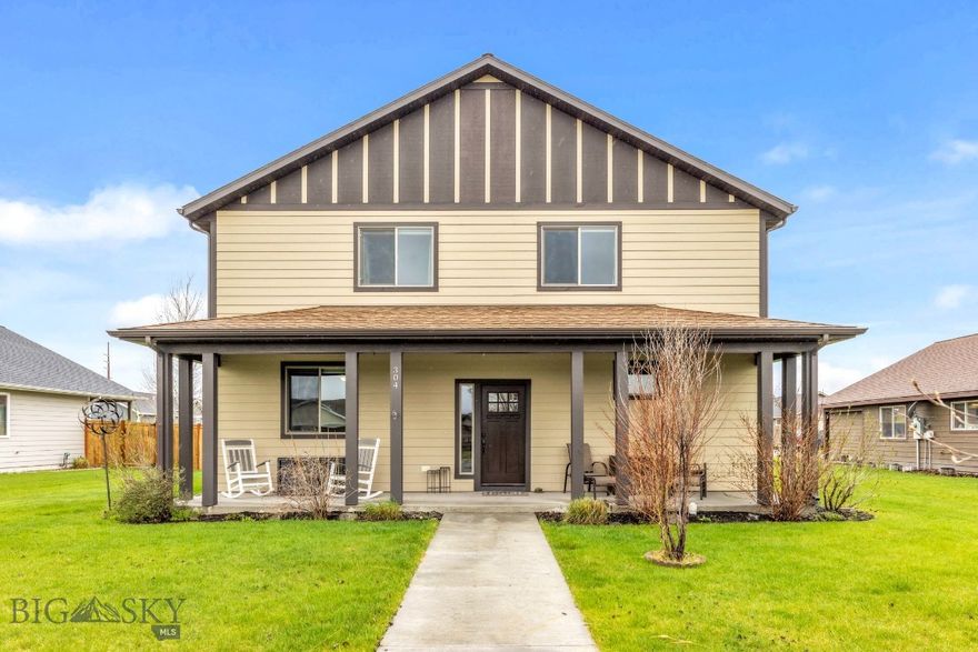 Welcome to the quaint town of Manhattan, Montana; where the black and orange tiger footprint flags line the main streets and hang proudly on high school game days. This beautiful home is located near the schools and walking trails. From the moment you walk in the house, the natural light floods into the spaces and feels like home. On the main floor you will find a living room, kitchen, dining room, beautiful wood burning fireplace, laundry room complete with a sink, a half bathroom for guests, and a large master bedroom with attached full bathroom. The master suite offers a large soaking tub with tiled surround, dual vanities and a walk-in closet. Upstairs you will find 3 sizable bedrooms, a second full bathroom with tiled shower surround and dual sinks, and a second living room.
Enjoy the oversized HEATED 3 car garage, fenced back yard, and covered back patio. The kitchen has an open concept and is perfect for entertaining.