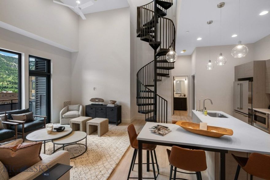 Elevate your everyday in Residence 3A, a thoughtfully designed 2-bedroom, 2.5-bath penthouse perched atop The Franklin—Big Sky’s newest boutique residential building in the heart of Town Center. Perfectly tailored for both quiet escapes and effortless entertaining, this home pairs refined mountain style with unbeatable walkability.

Inside, the airy floor plan is enhanced by 11-foot ceilings and curated finishes that strike the perfect balance between comfort and sophistication. Large windows draw in natural light and frame expansive vistas, while the open living space flows seamlessly onto a private rooftop terrace—complete with a hot tub—offering sweeping views of Yellow Mountain, Lone Peak, and the adjacent golf course.

Crafted by Bechtle Architects and built by Langlas Construction, The Franklin is a thoughtfully executed building offering the ease of lock-and-leave living with premium features: sound-insulated walls, heated underground parking, and private storage for your mountain gear.

From morning walks to your favorite coffee shop to evenings catching live music or dining nearby, Residence 3A puts you steps from it all. And when adventure calls, Big Sky Resort is just 10 minutes away, with river access and trailheads even closer. Move-in ready and designed for year-round enjoyment, this penthouse is more than a residence—it’s your personal launch point to the Big Sky lifestyle.