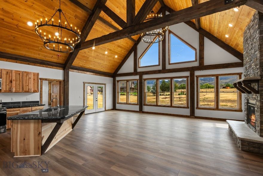 Brand new 2,040± SF home on 2.27± acres in the sought-after Homestead Subdivision, offering breathtaking views of the Tobacco Root and Ruby Mountain Ranges. Built with quality and durability in mind, this residence features an insulated concrete form (ICF) foundation and LP SmartSide siding for long-lasting performance. The main living area boasts vaulted ceilings with beams and dramatic floor-to-ceiling windows that fill the space with natural light while framing the stunning mountain scenery. A natural gas fireplace with impressive rock surround creates a warm and inviting focal point. The open-concept kitchen showcases concrete countertops, stainless steel appliances, and abundant workspace. An office or bonus room is conveniently located just off the front entry, ideal for working from home. The spacious primary suite provides a private retreat with a shower, soaker tub, and a generous 6' x 12' walk-in closet. Additional highlights include a 444± SF attached garage and a layout designed for both everyday comfort and entertaining. Experience modern comfort, high-quality construction, and the beauty of Montana living in this brand-new property, perfectly positioned for both privacy and accessibility to local amenities.