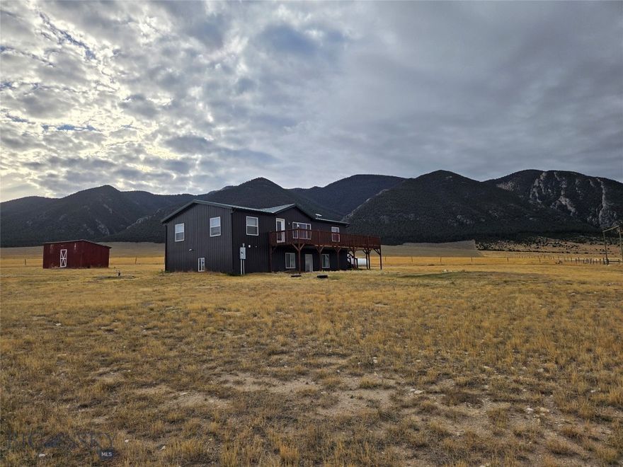 Privacy and impressive mountain views await you at this 5 bed/3bath home on 20 acres at the base of the Ruby Mountains. Bring your critters – outbuildings include barn, chicken coop, 2 sheds, and a run-in shed. The home’s main level  features kitchen, dining area, living room, master bed with en suite bath, two guestrooms, guest bath, laundry area, and enclosed porch/mud room. Basement offers 2 more bedrooms, a three quarter bath, and large common area with walk-out door to a covered patio. No covenants!