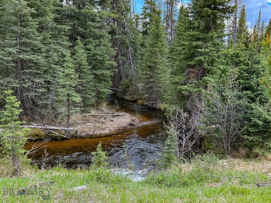 Situated along Cataract Creek, this off-grid lot offers a unique opportunity for those seeking a remote and rugged slice of Montana. Adding to the appeal of the land, it borders Forest Service lands along two sides, providing access to thousands of additional acres. The property features creek frontage and diverse terrain, with much of it steep and challenging, providing a truly untamed setting. Unlike the surrounding area, which has been significantly impacted by beetle kill and blowdown, this lot stands out with a healthy young timber stand resulting from timely logging. A rough road cut begins on the property, adding a starting point for access or development. While remote, with access dependent on winter conditions, the area is rich in wildlife, including elk, deer, and bear. It is a desirable spot for outdoor enthusiasts or those looking for a foothold in Montana’s wild backcountry.