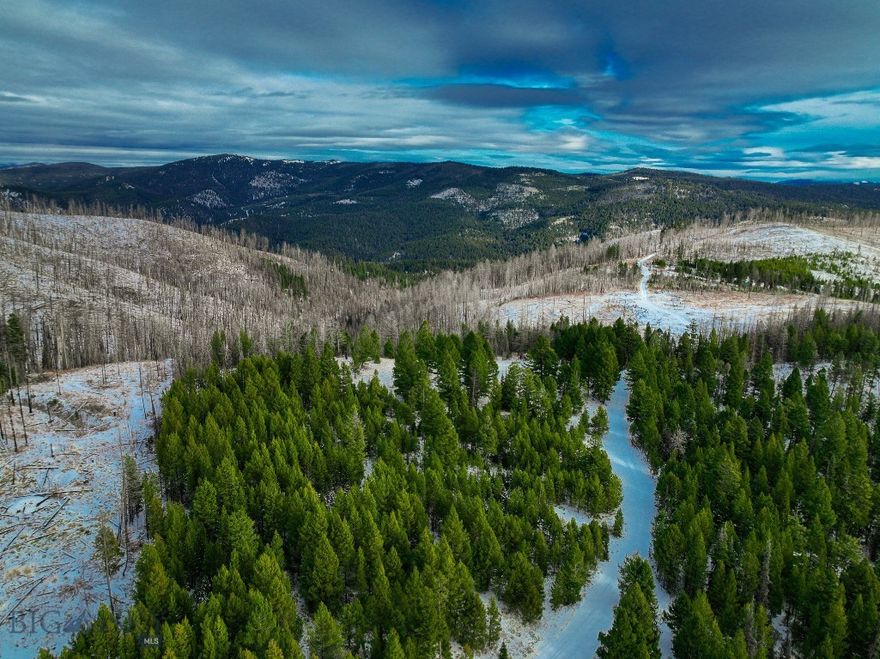 Escape to this expansive 20+/- acre property, nearly surrounded by stunning public (BLM) land. Perfect for sportsmen and outdoor adventurers, the land offers opportunities to see deer, elk, and moose as your closest neighbors. Accessible by a 4x4 road, this off-grid property provides ample useable ground to build a seasonal hunting cabin or secluded retreat. Many of the main roads in the are closed to wheeled vehicles from January through April. During the snow season, enjoy excellent snowmobiling areas nearby, featuring groomed trails and well-marked runs for the sledhead in the family.
Nearby, a large forest fire burn has opened the landscape for exceptional visibility and glassing opportunities for big game, while much of the property remains untouched, preserving its natural beauty and thriving timber. From this vantage point, enjoy breathtaking views across a landscape rich with wildlife and steeped in history.
Adding to its allure, this land is situated in an area renowned for its mining heritage and is a short distance from the historic ghost town of Garnet where you can explore remnants of another era.