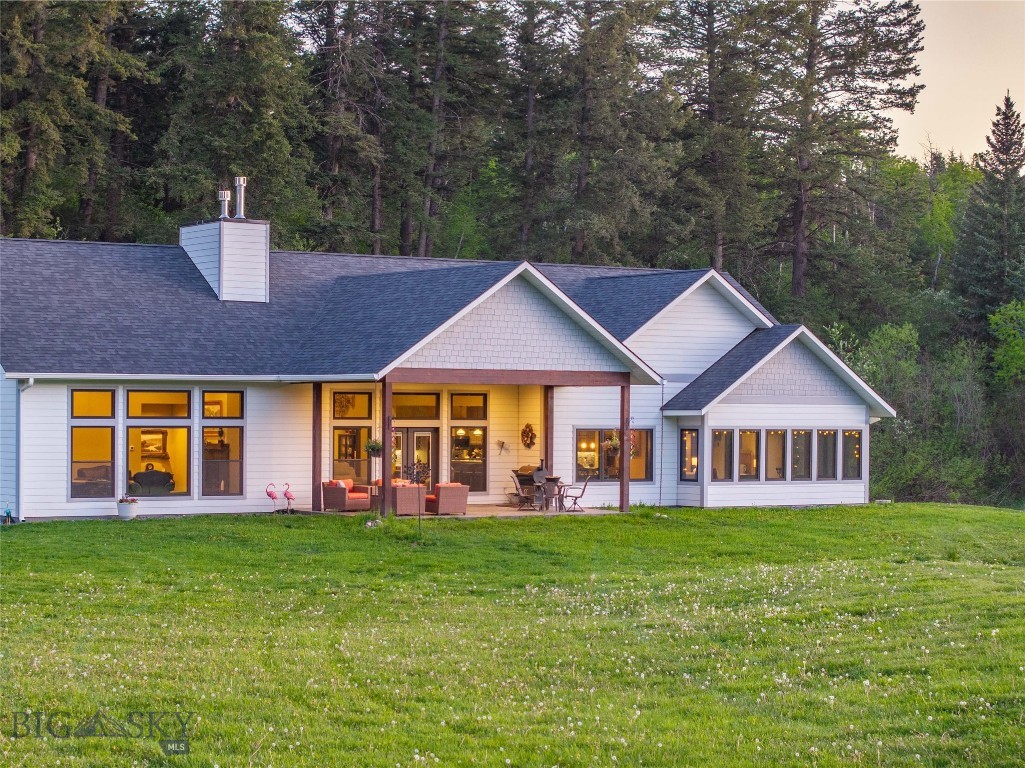 Tucked off a quiet road just minutes from Bozeman, this 22.6± acre property offers a rare combination of privacy, water frontage, and multi-residence flexibility. Set among mature trees with South Cottonwood Creek running through, the land feels like your own private park—secluded, serene, and full of natural beauty. The 4,184± SF custom 4-bedroom main home was built in 2020 with thoughtful design and refined finishes, including vaulted ceilings, engineered wood floors, a gourmet kitchen, gas fireplace, and a spacious main-level primary suite. Two additional bedrooms on the main level and a large bonus room with an extra bedroom upstairs provide plenty of space for family and guests. The 4-car garage provides plenty of space to store vehicles and all the your Montana lifestyle gear. The property also features a charming 2-bedroom, 1-bath guest cabin with a full kitchen, laundry, and cozy living area—ideal for visitors, multi-generational living, or rental income. Recreation is at your doorstep. Just 5 minutes to the South Cottonwood Trailhead, you’ll have quick access to miles of hiking, biking, and exploring in the Gallatin Range. The timbered upper portion of the property is a natural playground for kids and adults alike—perfect for hiking, camping, and adventure. There’s even an old picnic spot at a bend in the creek where locals once gathered, adding nostalgic charm to the landscape. Despite its tucked-away feel, the property is only 20 minutes to Downtown Bozeman, 30 minutes to the airport, and within easy reach of skiing, fishing, and public lands. With no covenants and abundant wildlife, this is a true Montana retreat—ideal as a full-time residence, vacation home, or legacy property to enjoy for generations.