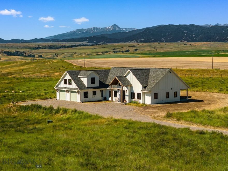 Welcome to this incredible custom home, perfectly situated on over 21 acres of pristine Montana landscape featuring a private spring. Designed to take full advantage of the breathtaking surroundings, this 3,3736 home features a dramatic open floor plan highlighted by a 20-foot wall of windows and sliding doors that perfectly frame sweeping 360-degree panoramic views of the Tobacco Roots, Lone Peak, and the Bridger Mountains. Inside you will find 3 spacious bedrooms, and 3 beautifully appointed bathrooms, and a chef’s kitchen equated with top-of-the-line appliances, ideal for entertaining or a cozy evening at home. With countless thoughtful design elements throughout, including vaulted ceilings that create a warm, sophisticated ambiance, custom white oak flooring, Douglas fir and elm accents, and a heated two-car garage, every detail of this home has been perfected. With convenient highway access and a quick commute to Bozeman, Ennis, or Three Forks, this unique property offers both tranquility and accessibility — the perfect balance of seclusion and convenience!
