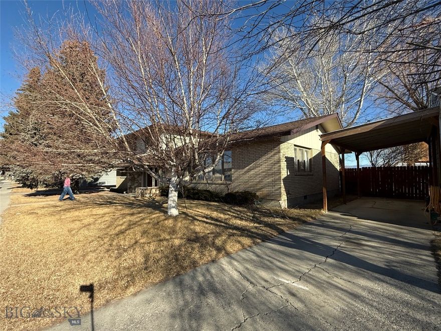 This beautiful large home located right by the elementary school, the junior high school and the high school is perfectly located for the people with a young family.  When I say close, you literally walk out the back door to the elementary and junior high schools with a two block walk to the high school.  This beautiful home has been meticulously taken care of since built.  It has had recent updates with lots of open family spaces.  The home has a two car garage and a beautiful fenced back yard.  This property is close to the high school football field and public parks and close to downtown Dillon.  Anyone looking for a magnificent home with an excellent location should take a look at this house.