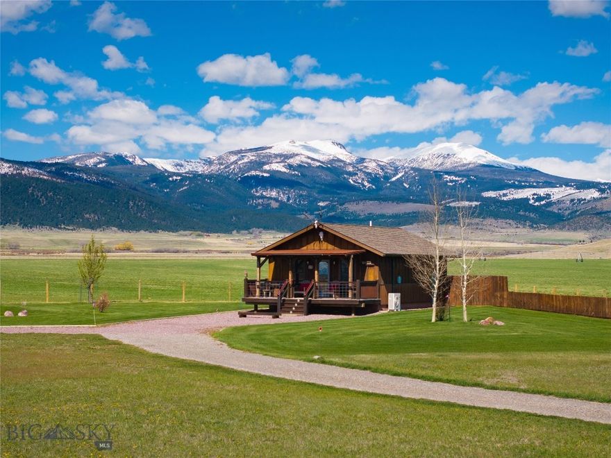 Escape to the heart of Montana with Trapper Cabin, a fully furnished turnkey vacation retreat located at 5469 US Hwy 287 in McAllister, just minutes from Ennis. This charming cabin sits on one irrigated acre surrounded by open hay fields, offering privacy, peaceful views of the Madison Valley, and convenient access to Lake Road, North and South Meadow Creek. The property features a great well, is fenced and cross-fenced, and includes underground sprinklers and a well-maintained gravel driveway. With no HOA or covenants, you’ll enjoy the freedom to expand—especially since the septic system is designed to accommodate an additional dwelling with up to three bedrooms. Trapper Cabin is currently a successful short-term rental managed by a local fishing lodge, earning $245 per night and supported by a strong rental history. The home offers a spacious master bedroom with an en-suite bath and walk-in shower, a laundry and utility room with direct access to a private fenced yard, and an open kitchen with an eat-in bar that flows into a cozy family room. Step out onto the covered front porch and soak in the sweeping Madison Valley views. Tastefully updated with mountain-themed décor and meticulously maintained, this property is only 45 minutes from Bozeman, 1.5 hours to Yellowstone National Park, and provides access to Big Sky via Jack Creek Road (with pass). Whether you're looking for a personal retreat, investment property, or future expansion opportunity, Trapper Cabin offers unmatched versatility, comfort, and Montana charm.