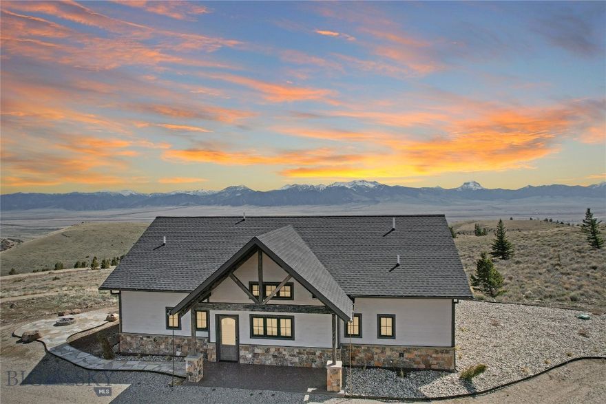 Beautiful Custom home located on almost 72 acres high in the Gravelly Mountain Range.  This 3 bed - 2.5 bath home has two ensuites on the Main Floor both with 10' walls, tray ceilings and extra large windows adding views to the custom touches.  The primary with a large walk-in closet and its own private entrance onto the stamped concrete patio gives you both privacy and access to an evening of serenity.  The primary bath has a double vanity with custom sinks that are graced by a smart mirror helping you organize your day after stepping out of the large custom tiled shower.  The Chef's kitchen includes a 5 burner propane range, microwave drawer, and a Butler's Pantry with lots of pull outs and storage.  The center island  in the kitchen seats 3 or there is also an area for a large dining table.  Throughout the main floor the vaulted ceilings, along with the huge eastern windows, creates a spacious feel as the heart of the home is centered around the propane fireplace and Madison Mountain views.  White oak flooring, soft close cabinets (crown molding), granite counter tops, custom curtains, blinds, sofa, tables, and rug (by Ethan Allen), and more unique items creating a truly custom home.  The professional landscaping has been started including a pathway to a firepit for wintertime enjoyment.  The house is low maintenance with color locked cement board siding & 4' stone wainscotting.  The detached 28' x 28' double car garage is ready for your toy storage as you are in the heart of trails (head over to Virginia City the back way), 16 Axolotl Lakes for fishing, and you're are only minutes to the Madison River for fishing or the National Forest lands for hiking, hunting, or horseback riding.  This one has it all with plenty of room to grow.  In Montana you don't just buy a property - you purchase a new lifestyle!!