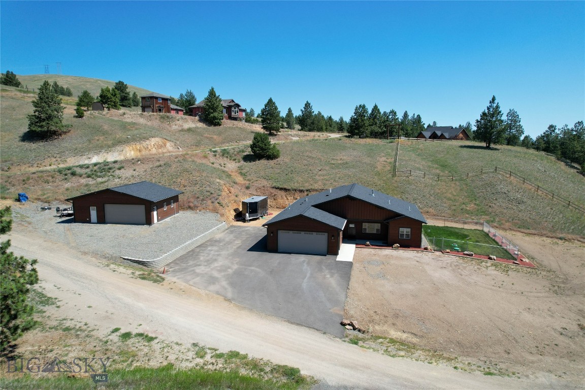 Welcome to 158 Jackson Creek Road in Montana City—where space, function, and freedom meet. Built in 2021, this beautifully designed 3-bedroom, 3-bath home offers 1,825 sq ft of open-concept living on a spacious 1.43-acre lot.
Enjoy a thoughtfully laid-out floorplan with the primary suite featuring a walk-in shower, soaking tub, and generous space for comfort and relaxation. The additional bedrooms are located in a separate wing, providing privacy for family or guests. Car enthusiasts, hobbyists, or anyone needing space will love the oversized two-car garage and the fully finished shop—complete with an office area and ample storage for tools, toys, and gear. Outside, you'll appreciate plenty of parking for trailers, a fenced dog run, and the wide-open Montana sky that surrounds you. Don't miss your chance to own this ideal Montana property. Schedule your showing today!
