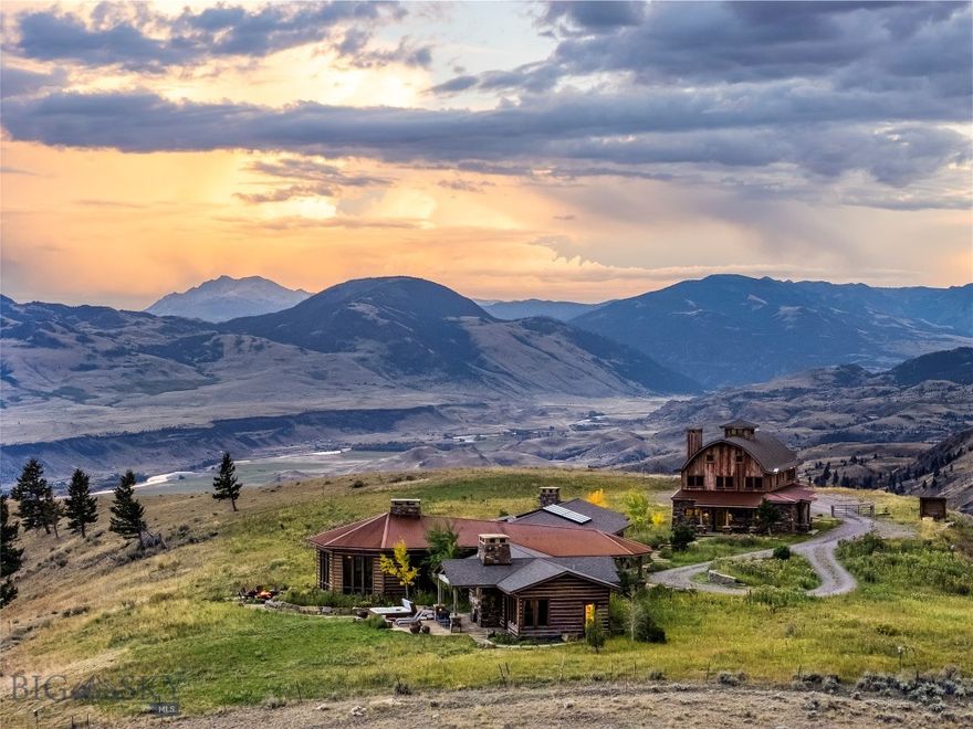 Paradise found in Paradise Valley. The New Moon Lodge is a spectacular home & guest house strategically perched high above the valley floor, offering breathtaking views of the Absaroka mountains. Situated on 21.37 acres and bordering public land, Yellowstone National Park is less than an hour away, world class fly fishing on Yellowstone River is just down the hill, and endless hiking, camping, and hunting opportunities abound. For those seeking unique Montana culture, historic and artistic Livingston is 30 minutes away, while the thriving college town of Bozeman is an hour.
The Main Lodge features vaulted ceilings with massive stone fireplaces, exposed reclaimed timbers, hardwood floors, and custom finishes & woodworking throughout. Large picture windows capture the views of the mountains, valley floor and Yelllowstone River. Entertaining is a breeze with two large dining tables, a full sized saloon-style western bar, and spectacular chef’s kitchen that boasts an oversized island, double dishwashers, double gas range, and sub-zero refrigerator and freezer.
The master suite is a very private wing of the main level that features a rock fireplace, spacious bathroom with walk-in shower, office space, screened in sleeping porch, exterior hot tub and outdoor fire pit. 
Also the ground level of the main lodge are 2 additional bedrooms, each with a private bath, and another cozy living area with a fireplace and ample seating. 
The downstairs has a game room with theater projector screen and a full-size billiard pool table. 
Next to the main Lodge is the Barn Bunk House, which, at 3,307 SF, is really an expansive second home. The ground level has an enormous laundry room with 3 washers & dryers, dog wash area, and oversized 2 car garage. On the upper level you'll find a kitchenette, loft, and 2 large bunk room-style bedrooms with attached baths and doors to the exterior balcony. 
The landscaping outside the lodge is equally awe inspiring with massive rock fireplaces, rock patios and walkways, mature pines and aspens, and of course, more exquisite views of the mountains.
The property has lots of flexibility and would make a perfect setting for corporate retreats, family gatherings, high end vacation rental that can sleep 20, or as your own mountain getaway. The New Moon Lodge is being sold furnished and is ready to host your next great adventure.
