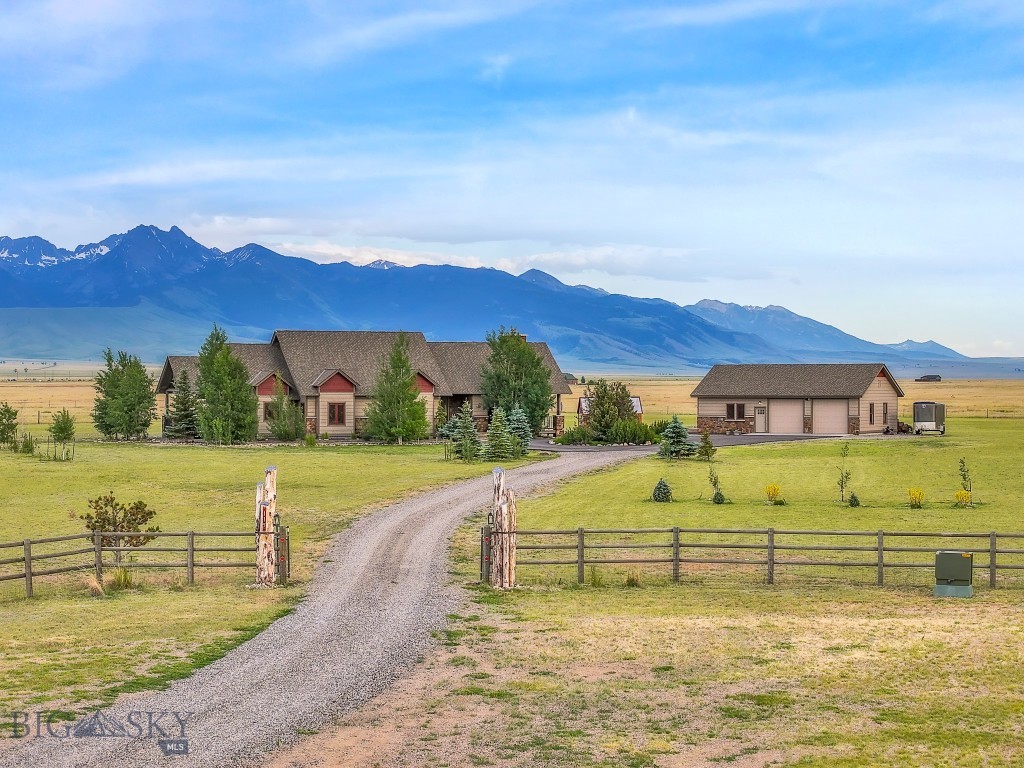 An exceptional 4,108 sq ft custom-built retreat set on 20.72 acres in the heart of beautiful Cameron, Montana. This unique property offers an oasis of comfort, privacy, and style, with sweeping views of the Madison Range and just minutes from the legendary Madison River and abundant public lands.
Thoughtfully designed for both everyday living and memorable entertaining, the main home blends Montana charm with modern amenities. Large windows throughout frame the breathtaking mountain vistas, while the open-concept living area features vaulted ceilings, a cozy fireplace, and a seamless flow into the kitchen and dining spaces. The kitchen is a chef’s dream, with high-end appliances, custom cabinetry, and ample room for gathering with friends and family.
The spacious finished basement adds versatile living space with egress windows and a walk-out door, making it ideal for a workout area, bunkroom, game room, or additional entertaining area, perfect for hosting large groups or creating a cozy retreat for guests.
A separate guest house provides even more flexibility, offering its own kitchenette and living area for visitors, extended family, or rental potential. The oversized two-car garage has plenty of room for recreational gear and equipment, supporting your Montana adventures year-round.
Outdoors, the property continues to impress with a large greenhouse, beautifully maintained landscaping, and a paved driveway that adds both convenience and a touch of polish to your rural lifestyle.
Whether you're relaxing on the porch with a glass of wine, hosting under the big sky, or casting a fly rod into the nearby Madison River, 115 Holding Pen Road offers an unparalleled setting to embrace the Montana way of life. With its combination of space, comfort, and location, this is a rare opportunity to own a truly special property in the Madison Valley.