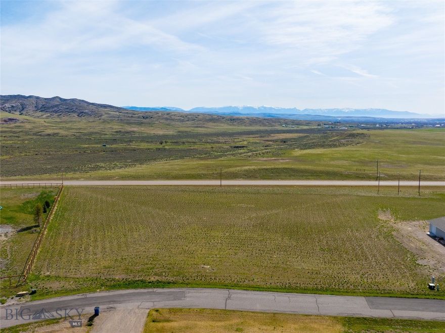 Welcome to Wheatland Meadows, a peaceful community nestled in the scenic rolling hills just off Highway 287. This level 2.16-acre parcel is ideally positioned near the front of the subdivision, offering a sense of privacy with elevated views that shield it from direct road visibility. Enjoy expansive mountain views from this quiet loop, where the generous lot size enhances the spacious, open feel.

Power is already available at the lot line, and the neighborhood features paved roads, well-maintained parks, and flexible covenants—including the option to build a shop—perfect for storing all your tools, toys, and outdoor gear. With quick access to I-90, Bozeman is just a short drive away.

Don’t miss your chance to build your dream home in this ideal Montana setting!