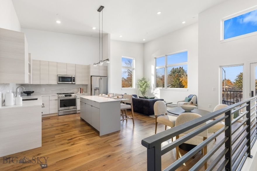 Located near downtown Bozeman, the beautifully designed residences at The Lofts on Beall offer modern luxury with a warm, elevated feel. Each unit is thoughtfully appointed with high ceilings, oversized windows, and an open-concept layout. The space is filled with natural light and refined finishes throughout. The kitchen features two-tone cabinetry, quartz countertops, and Café appliances—perfect for everyday living and entertaining. A private balcony extends the living space outdoors, while the bedrooms offer a peaceful retreat. With curated design elements, mountain views, designated parking, and an unbeatable location, this unit is a rare opportunity.