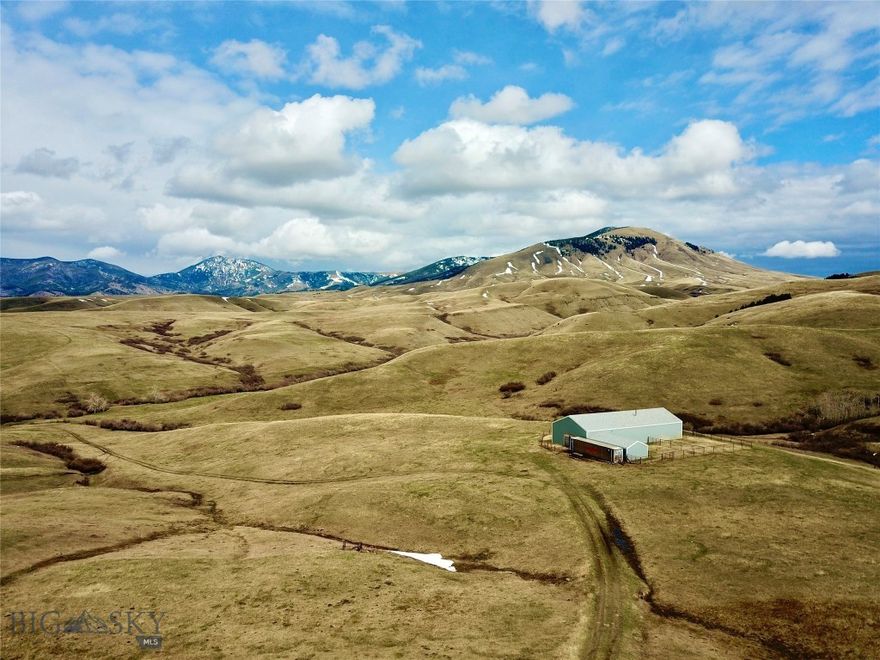 Discover the beautiful aspects of Montana, all rolled into one adaptable property! From where the 40’ x 100’ shop is situated, enjoy the sweeping vistas of the Highwood Mountains and the gently rolling terrain with coulees resembling veins supporting natural springs and various wildlife species. Cora Creek traverses the northern portion of these 160 acres. North of Raynesford, Montana, this property offers a rural lifestyle with plenty of space to explore and fresh air to breathe. The seller has invested significant effort into the infrastructure and dirt work, with three sides fenced, allowing you to bring your horses and cows. At the end of the gravel driveway is a shop, barn, shed, and corrals. A 2,800 sq. ft. portion of the shop has already been finished with insulation, sheetrock, and trim with the electrical all run in. The area operates from a generator and could be further customized to a buyer’s desire. Build your dream home or a vacation cabin. Take advantage of the short commute to Belt or Great Falls or use it as a base camp for hunting adventures. The Little Belt Mountains and Highwood Mountains provide exceptional hunting, fishing, hiking, and other outdoor recreation. Showdown Ski area is a short drive away, perfect for a day or weekend of skiing on fresh powder. Not bringing any animals? Lease out the pasture land for supplemental income. Experience the fusion of beauty, versatility, and opportunity in this Montana property!