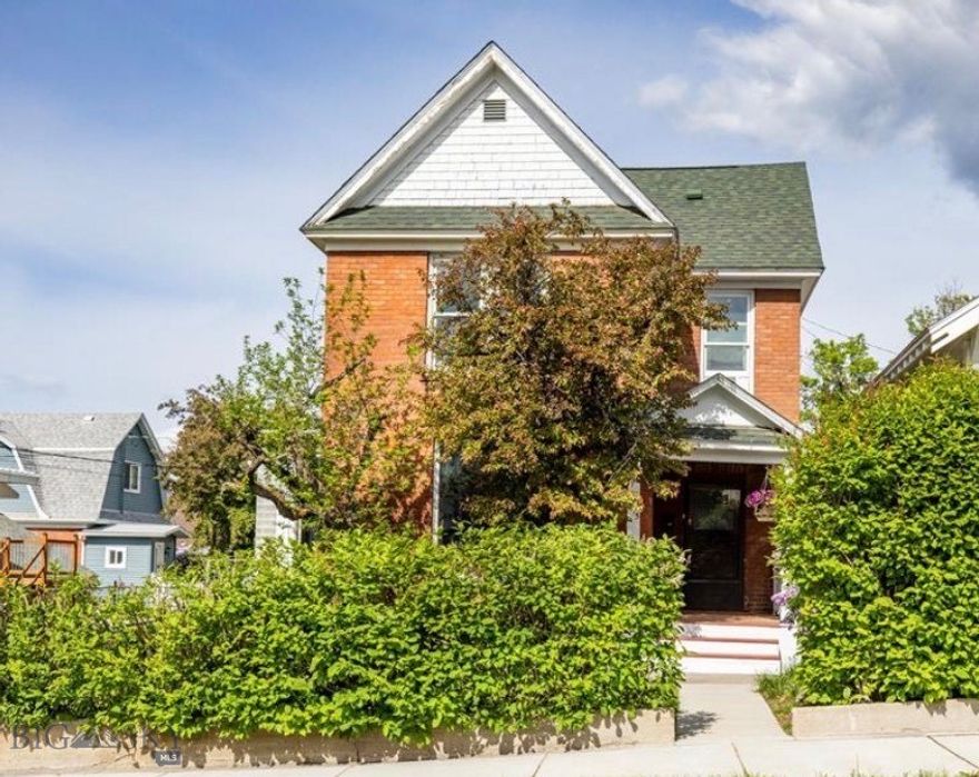 Charming Victorian in the historic Lower Westside neighborhood featuring an inviting covered front porch and welcoming entry. The main level offers a bright, open living and dining area with a functional kitchen and convenient access to the backyard.Upstairs includes multiple bedrooms, a flexible office or guest space, and a primary bedroom with built-ins.

Enjoy the private deck and large, fully fenced south-facing yard—perfect for relaxing or entertaining. Property includes a 3-car garage setup with space for vehicles, storage, or a workshop. A warm and inviting home full of  character and charm.