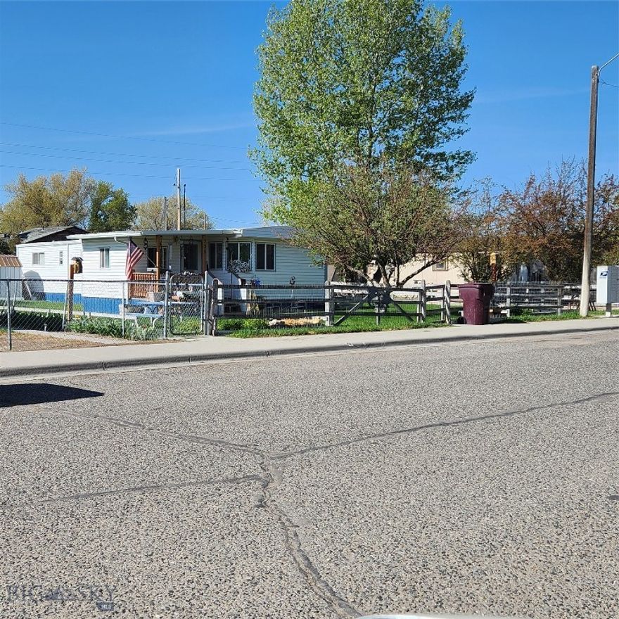 These are the lowest priced lots in Dillon at $55,000 per lot.  You can build multi-family, single homes, cottage business or just about whatever you want.  There are currently three mobile home spaces rented and an old tri-plex that should be demolished.  All mobiles are owned by tenants and are on a month to month rental so can be moved or prices raised.   There are 4 large lots and mature trees.  In walking distance to schools and grocery store.  Owner is motivated and may carry on a short term contract with agreeable terms.