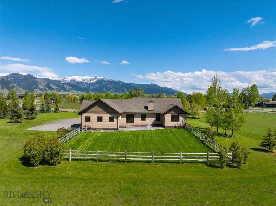 Welcome to 45 Spain Bridge Circle Drive, where wide-open space, privacy, and stunning views define everyday living. Set on 1.81 serene acres surrounded by protected open land, this rare property offers the feeling of a private retreat—yet it’s just minutes from Bozeman, Belgrade, and the airport.  Here, you’ll experience the best of Montana living: room to breathe, room to live, and room to take in the views. With over 4,100 square feet of thoughtfully designed living space, this home is crafted for comfort and effortless main-level living. The open-concept kitchen, complete with abundant counter space, stainless steel appliances, and a seamless flow into the dining and living areas, makes it easy to gather, entertain, or simply relax by the fire as you take in the mountain views. The main level features four spacious bedrooms and three beautifully finished bathrooms, offering plenty of room for family or guests—all conveniently on one floor. Downstairs, the fully finished basement expands your options even further, with a large bonus room, a fifth bedroom and new bathroom, extensive storage, and a massive workshop with direct driveway access—ideal for hobbies, home projects, or running a home business. High-speed fiber internet keeps you connected, whether you’re working remotely or streaming under the big Montana sky. Step outside and you’ll see what makes this property truly special: uninterrupted 360-degree views that stretch from the majestic Bridger Mountains to the fiery glow of Montana sunsets. A fenced backyard, underground dog fence, and oversized heated three-car garage make everyday life easy, while central air conditioning, a water softener, and ample storage ensure year-round comfort. This is more than a home—it’s a lifestyle. A place where privacy meets convenience, where space and serenity are matched by quick access to Bozeman’s vibrant downtown, Montana State University, Belgrade’s small-town charm, and world-class outdoor adventure in every direction. At 45 Spain Bridge Circle Drive, you’re not just buying a house -- rou’re claiming your piece of Montana—spacious, private, and unforgettable.