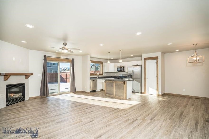 Priced to sell, this well maintained, single-owner spacious townhome, located across from a ~3.5 acre park space, offers 3 bedrooms, 2.5 bathrooms, a 2-car garage, fenced backyard, and incredible Bridger Mountain views, capturing both sunrise and sunset. This open concept floor plan is ideal for cozy evenings next to the fire, entertaining, and with a large landing space upstairs to make your own. Maximization of natural light was a priority for this well-insulated middle unit with large, strategically placed windows and doors. With over 1,900 SQFT of living space and a plethora of custom touches: full wood trim package, wide plank LVP floors, granite countertops, large pantry, upgraded SS appliances, gas range, tiled bathrooms, wide staircase, tiled entryway, gas fireplace with tile surround and wooden mantle, walk-in closet, and large bedrooms, this home is primed for its new owners. Conveniently located minutes from the Bozeman Yellowstone International Airport, 1308 Rizzo Lane, Unit B, is an incredible opportunity to own in the growing City of Belgrade.