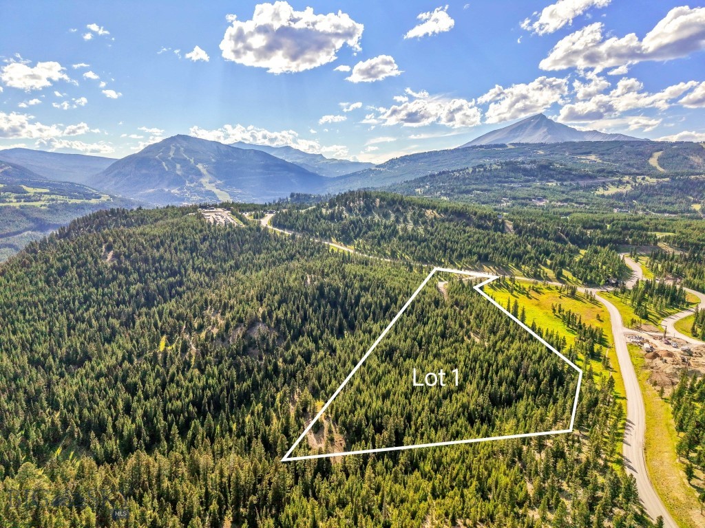 Tucked into a private grove of mature forests and expansive open space, Lot 1 in Wheatgrass Meadows spans 9.48 acres of private, pristine mountain living within Spanish Peaks Mountain Club. One of only two homesites in this exclusive new developer release, this property offers a rare opportunity to create a legacy estate in one of Big Sky’s most desirable communities.
This is not just a parcel of land—it’s a canvas with extraordinary potential. Initial landscaping and a rough driveway are already in place, making it easy to explore the site and start envisioning your future home. Picnic tables with scenic views have been thoughtfully placed to encourage you to pause, breathe in the fresh mountain air, and soak in the panoramic landscape.
Very few properties offer this kind of scale and flexibility—design an 8-bedroom main residence alongside a 3-bedroom guest home, all set against the stunning backdrop of Big Sky’s rugged beauty. Whether you’re bringing your own team or prefer a streamlined approach, you have the option to leverage the Spanish Peaks Design Build Program, which simplifies the entire building process.
A Signature Golf or Social Membership is available with this property, providing access to the premier amenities of Spanish Peaks Mountain Club, including Tom’s 10 Par 3 Golf Course, the new Aspire Lodge, and a network of trails and recreational offerings. Just minutes away, the Montage Big Sky delivers five-star hospitality, fine dining, a world-class spa, and ski-in/ski-out access to Big Sky Resort.
Lot 1, Wheatgrass Meadows is where the unmatched beauty of Montana meets the elevated lifestyle of Spanish Peaks. This is a legacy property—ready for your vision.