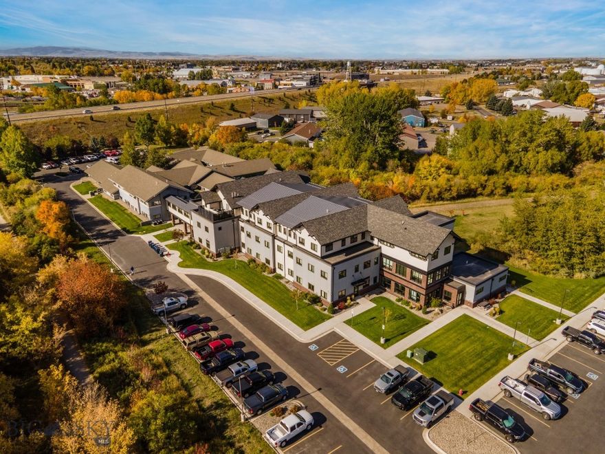Amazing office property in quiet northeast Bozeman location.  Tucked away in the trees, but close to the Cannery District, Downtown, Interstate 90 with walking trails right at the edge of the lot.  Amazing views of open space and the Bridger Mountains, with Bozeman Creek running along the West border of the lot.  Adjacent access to Story Mill Community Park and the Trail to the M.  Great finishes throughout this office complex with individual climate control in each office.  There is a nice reception area, several conference rooms, mail rooms, locker room with showers and break rooms.  There are two buildings connected with an annex, so the complex could be further demised into smaller configurations, feel free to inquire about any size.