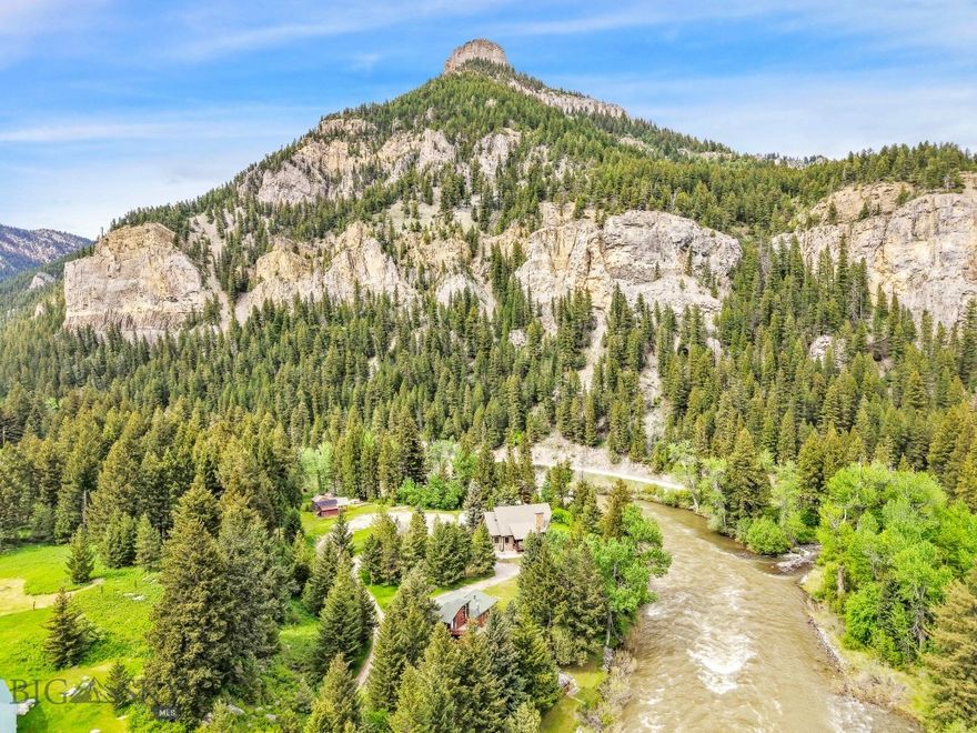 Rare Gallatin River Frontage. Nearly ½ Acre. Iconic Montana Setting.  Sitting along the banks of the legendary Gallatin River, this cherished family cabin sits on two separate parcels totaling approximately 0.49± acres of premier Montana riverfront property. With direct Gallatin River frontage, this offering is a speical opportunity to own a private stretch of blue-ribbon trout water in one of Southwest Montana’s most sought-after recreational corridors. “A River Runs Through It” was filmed just beyond the back door, an enduring testament to the breathtaking beauty and cinematic landscape that surrounds you. Fish world-class waters steps from your cabin, with Storm Castle Creek joining the Gallatin just downstream. Launch a raft or kayak upstream and float home to your own riverbank. After a day on the water, unwind in the sauna, relax by the fire, or simply take in the sights and sounds of the river flowing past your property. The cabin exudes rustic Montana charm. A wood-burning fireplace anchors the living area, while a vintage wood stove adds warmth and character to the kitchen. Featuring two bedrooms and one-and-a-half baths, the layout is comfortable and inviting, perfect as a recreational retreat, rental opportunity, or family cabin ready to create amazing memories.  Located minutes from Big Sky, Bozeman, and endless public lands, this property offers year-round access to fly fishing, rafting, hiking, skiing, and adventure. If you’ve been searching for authentic Montana riverfront real estate with privacy, history, and unmatched access to the Gallatin River, this is a truly rare find. Come experience the magic for yourself.