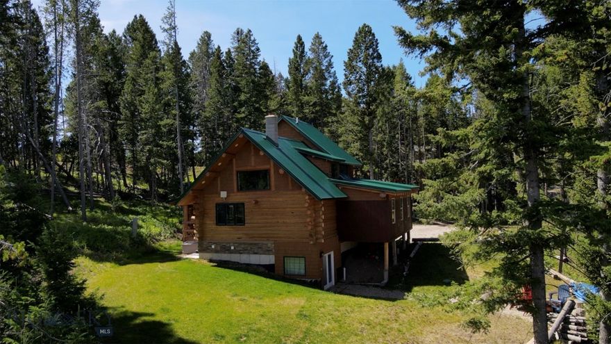 Whether you are looking for a part-time getaway or a full-time haven, 617 Fire Lane at Georgetown Lake, MT offers a quiet slice of mountain living tucked near a scenic alpine lake. Georgetown Lake is one of the best all-season recreational areas in all of Montana, rich in recreation, wildlife and scenery. Boating, fishing, hiking, 4-wheeling, golfing, skiing at Discovery Basin Ski Resort, snowmobiling, hunting are all out your back door or only minutes away. Located just off Montana Highway 1, mid-way between Anaconda and Philipsburg which are only 20 minutes away. Less than an hour to Butte and two hours to Missoula.  The log-cabin house showcases a rustic design both inside and outside to fit the character of the area. On the main floor you will find chef-ready kitchen with high-end appliances and a sleek stainless-steel island, dining area, living room, a full bathroom and a heated sun-room ideal for soaking in the views.  The loft hosts a serene Master Suite accompanied by a comfortable sitting area, offering a quiet retreat.  The walk-out basement features a family room, two more bedrooms, a versatile bonus room with additional sleeping areas, and a full bathroom accented by a beautiful large tiled shower.  Year-round access via a county gravel road. This property is a perfect place to slow down and relax and enjoy the special lifestyle that comes with the beautiful surrounding, tranquility and recreational opportunities.   And if you're not using it full-time, short-term rental potential offers an opportunity for additional income.   Check out the attached exterior drone video for a bird’s-eye view of this exceptional mountain getaway