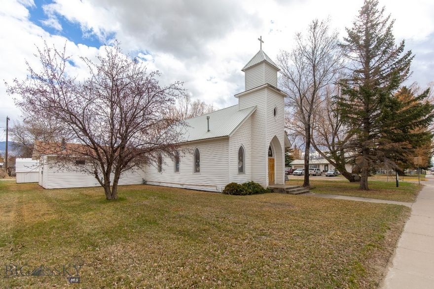 With a meaningful history in the Twin Bridges community, the former Notre Dame Missionary Church offers a versatile opportunity for its next chapter. Built in 1950 and thoughtfully maintained over the years, this 2,176± square foot property is well-positioned for a range of future uses. Inside, the vaulted sanctuary offers an open, light-filled space, complemented by a large community room suited for gatherings and events. The layout also includes a full kitchen with an adjoining smaller gathering space, two bathrooms, handicap-accessibility, and a dedicated mechanical room providing practical storage. The overall design balances functionality and character, offering flexibility for a variety of needs. Situated on a prominent 0.643± acre corner lot along Main Street, the property is framed by mature trees and includes a dedicated off-street parking area. Its prime, high-visibility location within Twin Bridges enhances both accessibility and potential. Whether continuing as a place of assembly or being reimagined for a new purpose, this property presents a compelling opportunity for those who recognize both its established presence and the possibilities ahead. Interior photos will be uploaded in the coming days. For more information or to schedule a private showing, please contact your real estate professional.