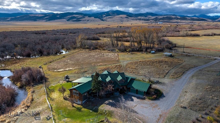 Set on over 470 private acres in Canyon Creek, Montana, Phantom Spring Ranch captures the essence of Montana living, space, beauty, and craftsmanship shaped by the land itself. Designed and built by an artist, the 6,148-square-foot main residence reflects creativity in every detail, with vaulted ceilings, wide hallways made for displaying art, and windows framing panoramic views of rolling hills, aspen groves, and distant peaks. The property stretches across meadows, timber, and a creek bottom, with approximately three-quarters of a mile of Little Prickly Pear Creek winding through. Beaver ponds, a solar-fed pond, and historic water rights dating back to the late 1800s sustain a lush riparian habitat that draws moose, deer, eagles, beaver, and sandhill cranes. The lower meadows have supported grazing for 30-35 cow/calf pairs in summer months, with a history of small-scale hay production. Living Area includes both Main House & Caretaker Cabin! The main floor centers on an open kitchen with a granite farmhouse sink, Sub-Zero refrigerator, double ovens, and spacious pantry—a warm, inviting space framed by soft cream and wheat tones with blue cabinetry inspired by the Montana sky. A light-filled art studio doubles as a yoga or creative space, while wide hallways allow for gallery-style art display. The primary suite is designed for ease, featuring no-threshold transitions, a walk-in shower, and wheelchair-accessible doorways. Upstairs, a large guest room with dual queen beds and cozy sleeping alcoves overlooks the art room, a space as functional as it is imaginative. The lower level includes another bedroom, full bath, private living area, and abundant storage, offering flexibility for family or guests. From every level, natural light and landscape views shape the experience, creating a calming environment and connection to the outdoors. A 1,040-square-foot caretaker’s cabin provides comfortable accommodations with one bedroom, bath, and basement bunkroom, perfect for guests or onsite help. The two-story barn offers equipment storage, workshop space, and a loft above, while an open-air event shed near the firepit has hosted barbecues, art camps, and family gatherings. Phantom Spring Ranch is Montana at its best: spacious, private, and full of quiet beauty. Whether you’re managing livestock, exploring the outdoors, or simply soaking in the scenery, this ranch offers the freedom to live life on Montana time.