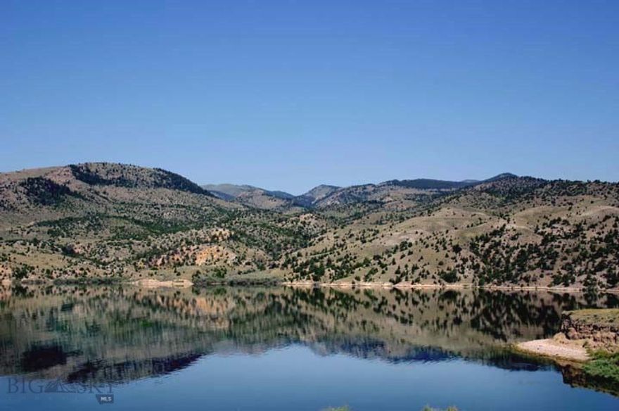 BLUE WATER RANCH: UNEQUALED-TOTALLY UNIQUE RANCH! That’s our opinion, and we believe you will enthusiastically agree!   UNEQUALED-TOTALLY UNIQUE RANCH! That’s our opinion, and we believe you will enthusiastically agree!   Where else could a discriminating owner shelter wealth in an uncertain world environment, and simultaneously enjoy approximately 1.16 +/- miles of lake frontage on the deep, blue, rainbow trout filled waters of Ruby River Reservoir--coves, beaches, rocky cliffs, and two warm spring ponds and potential for more ponds, reservoirs and water features. Impressive rock formations, grazing pastures, rolling and rugged hillsides with juniper and pine, as well as truly stunning views of five mountain ranges: The Rubies, Upper Rubies, Snow Crest, Tobacco Root, and Greenhorn ranges. There are many excellent building sites, including one of the finest locations in southwest Montana.  The Ranch is comprised of 380.83 acres, and bounds an additional 330 acres of BLM--wild, otherwise difficult to access, tree filled hillsides and rugged canyons teeming with wildlife.