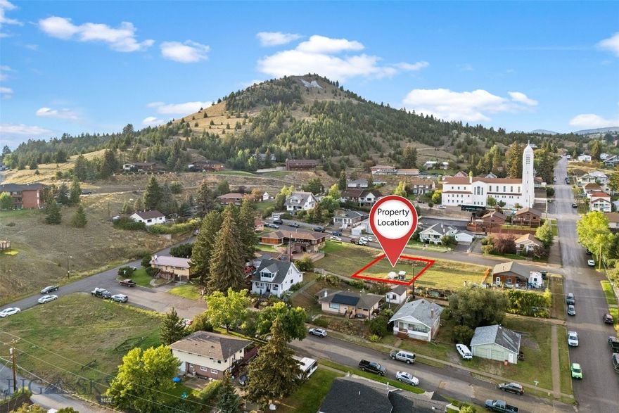 Build your vision in the heart of Uptown Butte! This mostly flat residential lot offers a prime location within walking distance to Montana Tech. Enjoy a front-row view of the famous Big M and fireworks each 4th of July, making this a rare opportunity for both convenience and charm. Public utilities are available, and the lot provides plenty of flexibility for a future home or investment. This lot is being sold individually, but an adjoining lot is also available—perfect for those looking for extra space or investment potential.