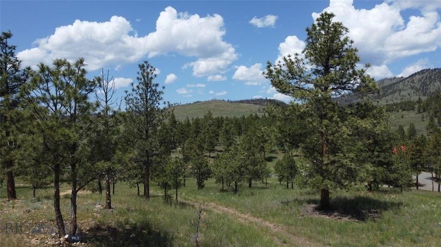 Tucked in the North Hills of Helena- a rare opportunity awaits! This 3.49-acre property is ready for your new build. Water is available through the Mountain Heritage Water Association; this means no need to stress about digging a well, nor the big price tag that would be involved in drilling a well- just hook up the already existing system! This property has an approved septic location and is ready to be built on, and for your vision. Enjoy your view of the Big Belts, mature pines, natural vegetation and rolling hills. Explore back door access to Hauser, while still being 20 min from town. Feel the removal from civilization while still having community. Hiking trails and fishing opportunities are right around the corner for you to enjoy all day and then come home to your dream property. The varied grades of the property allow for a view while still offering solid options for different construction styles as well as options for placements of a shop or barn.