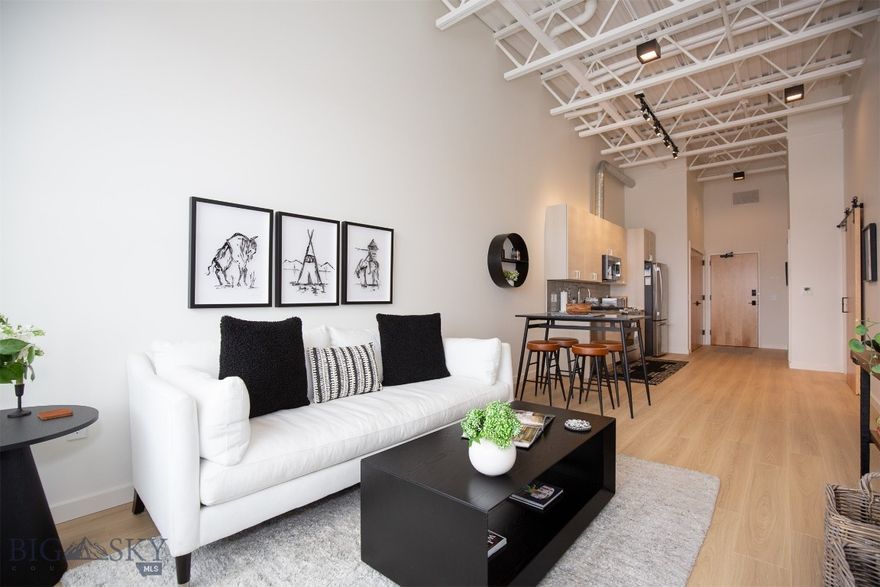 Step right into this beautifully upgraded, turnkey condo in the vibrant Aspen Crossing building—one of Midtown Bozeman’s hottest spots! Bathed in natural light year-round, this south-facing 2-bedroom, 1-bath unit features expansive windows and elevated finishes throughout.

The second bedroom offers versatility—perfect for a stylish home office or cozy guest room. Floors have been recently updated to wide-plank oak laminate that’s as durable and easy to maintain as it is eye-catching.

Whether you're looking for a full-time home or a part-time Bozeman base, you'll love the energy of Aspen Crossing. With popular local hangouts like Ponderosa Social Club and Bourbon BBQ just steps away, there's always something happening right outside your door.

Though this condo has never been rented, similar units in the building enjoy strong demand and excellent occupancy for both mid- and long-term stays—making it a potential investment opportunity as well.

The unit is offered fully furnished (with just a few exclusions—ask Liz for details), so you can start enjoying the Midtown lifestyle from day one.

Interested? Reach out for more details or contact your agent today to schedule a private showing!