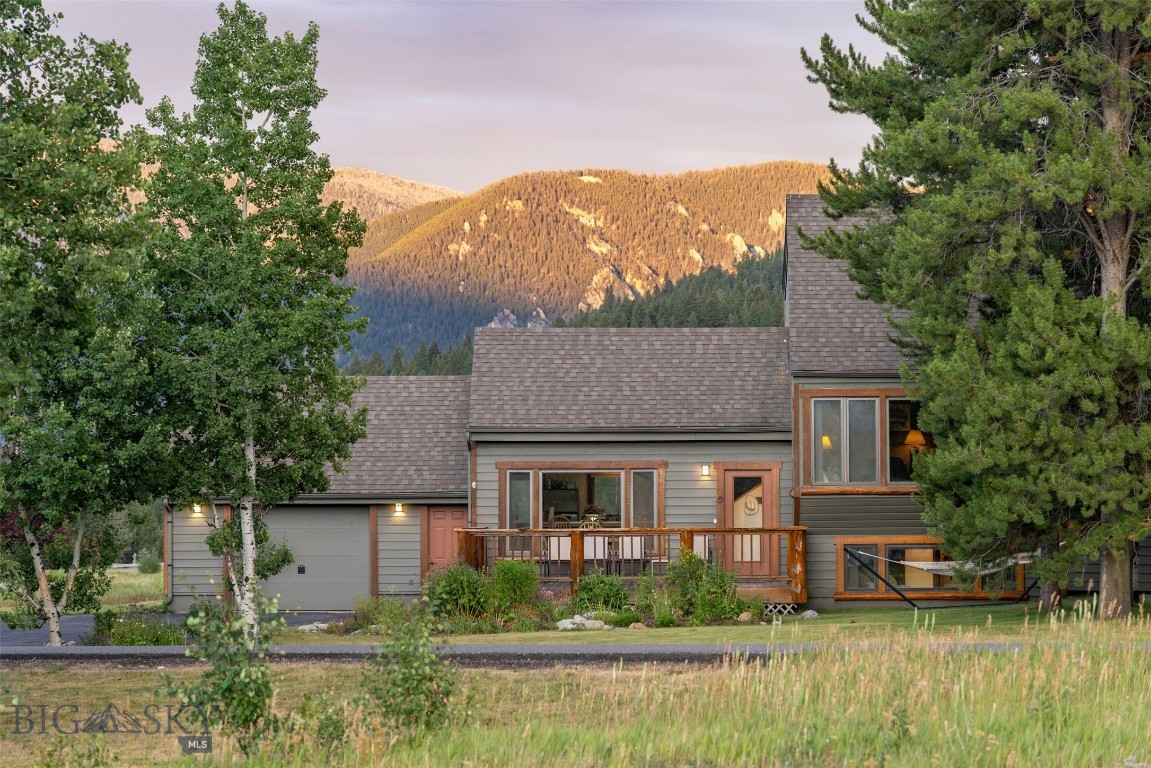 Perfectly positioned in Big Sky’s Meadow Village, 2120 Yellowtail is a charming and well-maintained 3-bedroom, 3-bathroom single-family home offers unbeatable views, direct golf course access, and a lifestyle tailor-made for mountain living. Backing onto the 12th green of the Arnold Palmer–designed Big Sky Resort Golf Course, the 2,136 sq ft home sits on a spacious 0.275-acre lot surrounded by mature trees, natural beauty, and big Montana skies.
From the living and dining rooms, perfectly framed windows put Lone Peak front and center, while the back deck delivers expansive vistas of the Gallatin Range and Levinsky Ridge—ideal for morning coffee or post-adventure sunsets. Whether you’re skiing Big Sky Resort, biking world-class trails, fly fishing the Gallatin, or cross-country skiing just steps from your door, this location puts you at the heart of it all. Shops, restaurants, the post office, and Town Center events are just minutes away.
Inside, you’ll find vaulted ceilings, a cozy wood-burning fireplace, and warm finishes that create a welcoming retreat. The layout is functional and inviting, with three spacious decks and quirky-rustic wood paneling. The attached garage is ideal for stashing skis, bikes, and all the gear you need to live your best Big Sky life. Clean, cozy, and move-in ready, this home offers the perfect balance of comfort, character, and convenience.
Don’t miss your chance to own this slice of Montana paradise. Take a 3D tour today, or better yet, schedule a showing with your favorite Big Sky real estate professional. Priced to sell—this one won’t last long!