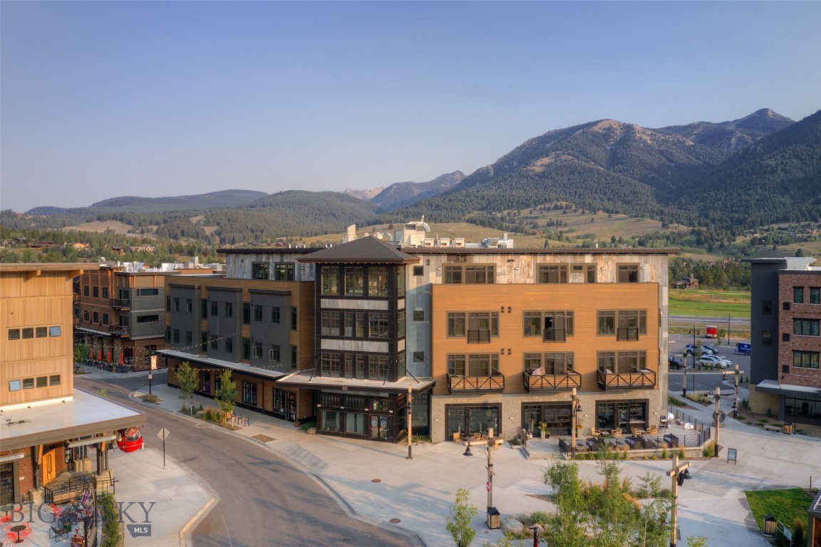 On top of it ALL -- what a very special opportunity to own a one-of-a-kind extremely hip mountain contemporary designed penthouse with just a hint of a city loft vibe, this 3 bedroom, 3 and a half bathroom residence is elevated above just about everything Town Center. Offering front and center views of Lone Peak, Spanish Peaks as well as views down valley this is ready and waiting for you and your loved ones to call home in Big Sky. Bring that party outside on your very own private wrap around deck, take in all the activities and events the Big Sky Town Center has to offer all while enjoying coveted privacy. Take in the sounds of the Big Sky Art's Council's Music in the Mountains without ever having to worry about crowds, not to mention other well-known and well-loved Big Sky events such as PBR, summer farmer's market, special holiday events, Blue Buddah Sushi Restaurant just an elevator ride away and much much more. When location and address is everything 99 Town Center Avenue is undoubtedly it! This unit also has its own private storage unit on the lower floor of the complex.