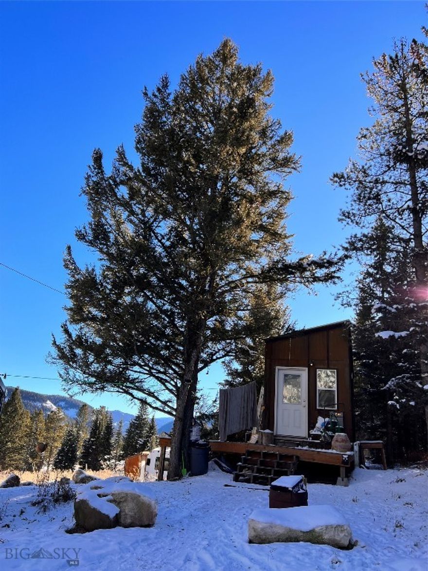Situated in the Gallatin Canyon South area overlooking the Gallatin River drainage and close to Forest Service public lands, this tiny home and 2.0  acre lot gives you a great opportunity to build your dream home while living and working on the property.
There is a 3 bedroom septic system installed where the  tiny home is currently placed and 2 - 200 amp separate electric services.
The property is 5 miles to the entrance to Yellowstone National Park and 10 miles to Big Sky.
Walk across the street to the Gallatin River to fish or hunt, ride or hike out the back door on the hundreds of acres of Forest Service land.