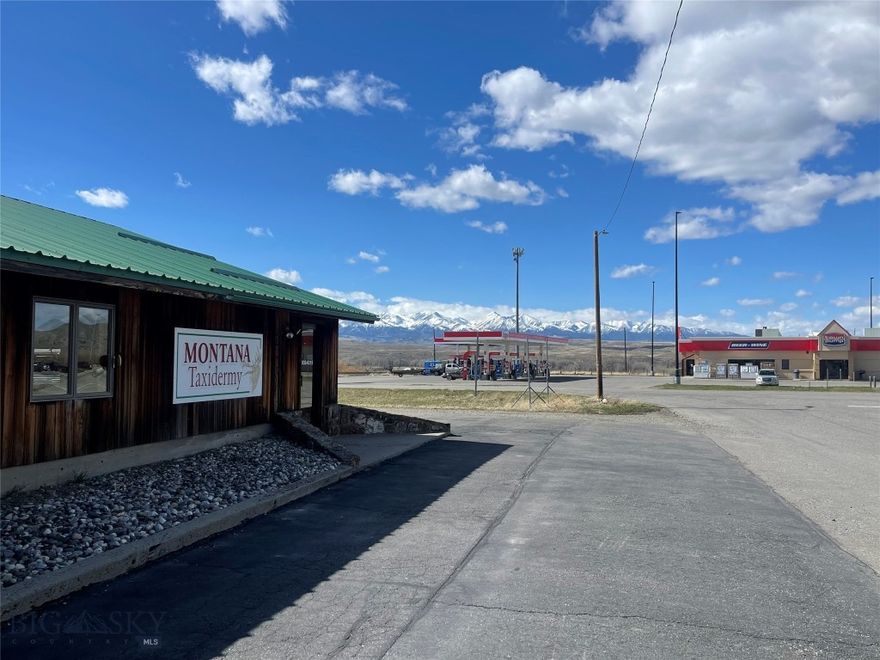 Location, location, location! With beautiful views of the Crazy Mountains to the north, this building and vacant adjacent lot are just waiting for you to bring your business to town! This property is zoned Highway Business which allows for numerous legal uses. The property is on the prime corner of Big Timber Loop Road and Quarry Street within the City Limits of Big Timber, MT, a thriving western town in the south-central portion of the state. Big Timber is conveniently located between Bozeman and Billings, Montana just off of Interstate 90. The property includes the 2,016 square foot building with an attached 540 square foot garage area. It also includes a vacant lot adjacent to the building on the west side. The total acreage is 0.425 acres with the main building being on 0.233 acres and the vacant lot being 0.192 acres. The total square footage of land is 18,513 square feet. On city sewer and water as well as natural gas. Properties with this type of possible exposure to the general public, beautiful views, and potential are a rarity!