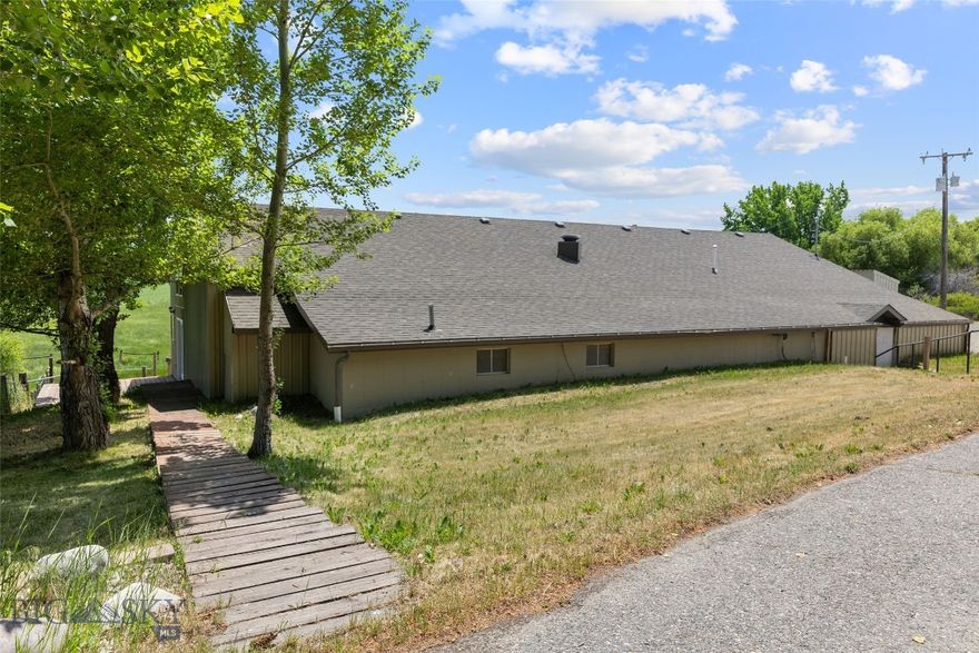 Prime Commercial Opportunity with Unmatched Views and Versatility

Unlock the potential of this 7.5-acre property just minutes from Bozeman, offering exceptional visibility and high-traffic frontage—ideal for a variety of business ventures. The building is a 3500 sq ft commercial-grade shop, perfectly suited for retail, warehouse, light industrial, or service-based operations. With excellent signage along a well-traveled road, this location offers built-in exposure and easy access for clients and deliveries alike.

In addition to the commercial space, the property includes a spacious 5-bedroom home—perfect for an owner-operator, employee housing, or even rental income. The home features sunlit living spaces, a functional layout, and unbeatable Bridger Mountain views, creating a truly unique work-live environment.

Added bonus: The property could potentially be subdivided into two lots, opening the door for future development, investment potential, or increased flexibility for long-term planning.

Whether you're looking to expand your business, invest in flexible-use property, or establish a headquarters with room to grow, this one-of-a-kind opportunity combines land, visibility, and lifestyle—all in a stunning Montana setting. Also listed as MLS# 403109 and 403108.
