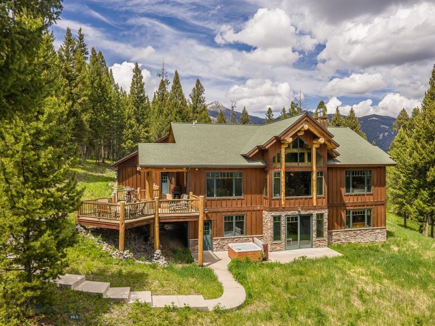 This stunning home, built by Blue Ribbon Builders, is nestled into a grove of old growth pines on a 20 acre parcel just minutes to Town Center. The southern exposure bathes the primary suite and most of the living spaces in sunlight while affording expansive views. The vaulted ceiling, log accents and propane fireplace in the great room create cozy seating areas adjacent to the open dining kitchen entertaining area. During the summer months, the expansive outdoor areas move family and guests into the surrounding nature, where it is common to see elk, deer and the occasional bear. 

This is the quintessential Big Sky getaway featuring the privacy of a large parcel with the proximity of all amenities of the Meadow Village and Town Center. Blue ribbon fly-fishing on the famed Gallatin River is just a few miles away. Yellowstone National Park will be your new back yard, which you can visit in under an hour's drive. Ski the slopes of  Big Sky Resort or the cross country trails of Lone Mountain Ranch. Enjoy Big Sky in every season. Come experience the free weekly summertime concerts, Farmer's Market, professional rodeo events, skijoring, music festivals, endless hiking, biking and fun on the river. Make 725 Sandhill Road in Big Sky your basecamp to endless fun and adventure!

Offered furnished, excluding artwork, personal items.
