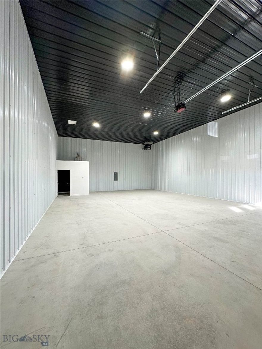 Brand-new commercial warehouse in North Belgrade, conveniently positioned near Bozeman Yellowstone International Airport with easy interstate access just minutes away. This insulated, heated metal building offers versatile space ideal for business use or personal storage. With 18-foot ceilings and a spacious 14' x 14' overhead door, it’s well-equipped to handle large vehicles, machinery, and recreational gear. Designed for durability and minimal upkeep, this property combines efficiency, functionality, and long-term value.