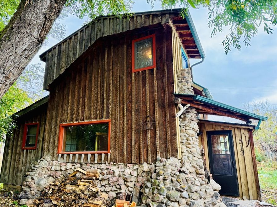 Fun and full of personality—this home sits right in the heart of one of Bozeman’s coolest neighborhoods. If you’re after something with character, you’ll love the custom rockwork, unique tile, and exposed wood beams. The main level bedroom is bright and cozy with armoires and big windows, while the upstairs bedroom feels like a treehouse hideaway with loads of natural light.  Oversized, south facing windows in the kitchen bring in abundant sunshine. Other attributes include a spacious laundry room, & multiple mudroom/foyers.  Natural gas stove with thermostat for heating plus a wood stove for those chilly winter nights, along with an on-demand water heater. 

Need extra space? There’s a detached 200+ SF building that’s perfect for a home office, art studio, or whatever you dream up. Outside, you’ll find mature landscaping, multiple sheds for all your gear, a tucked-away firepit for gathering with friends, and room to spread out on a 6,000+ SF R2-zoned lot with alley access.

And the best part is you’re just steps from breweries, bakeries, and everything that makes Northeast Bozeman such a great place to be.

Call today and come check it out!