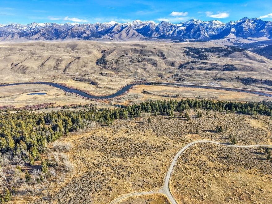 Discover this premier build site in Sun West Ranch. 6.01 acres perfectly positioned above the Madison River with commanding views of the valley and the western face of the Madison Range. This mostly level terrain with gentle eastern slopes that wooded with mature timber, provides the ideal setting for a custom home with 360° views and southern exposure. Enjoy paved-to-gravel access close to the main gate yet set apart for privacy. Ownership at Sun West Ranch offers access to 1,600 acres of shared open space, three miles of private Madison River frontage, equestrian facilities, riding and hiking trails, and abundant wildlife. A rare blend of seclusion, scenery, and Montana luxury.