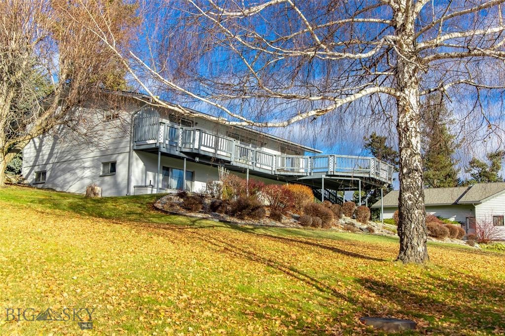 A Rare Opportunity to Own a Slice of Flathead Lake Paradise Embrace the ultimate lakeside lifestyle with this exceptional property in Lakeside, featuring almost half a football field of Flathead Lake frontage. Nestled on a gently sloping, meticulously landscaped almost acre lot, the property includes a serene pebble beach and a cement dock with three slips, perfectly suited for all your watercraft adventures. Located in the sought-after Lakeside community, the property combines breathtaking views with a sense of seclusion, enhanced by the HOA common area bordering the east. During winter months, the nearby Blacktail Mountain Ski Resort—just minutes away—offers incredible opportunities for skiing and snow recreation, ensuring year-round outdoor enjoyment. Don’t miss this rare chance to experience Montana's most iconic lakefront living!