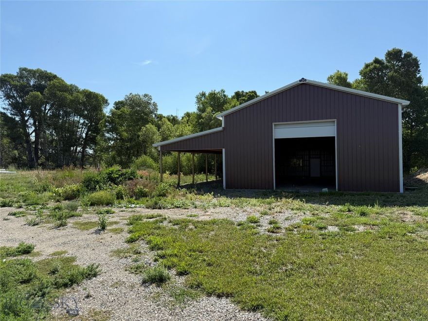 Enjoy spectacular views from this unique opportunity within the Powderhorn Ranch Planned Unit Development (PUD). In a PUD, each owner holds title to their individual residence, while the surrounding common areas are jointly owned by all members of the development. Powderhorn Ranch spans 30.05 acres and includes six residential lots. Each lot comes fully equipped with installed utilities—natural gas, electric, water, DEQ-approved septic, and telephone service. Owners also share access to common amenities, including a hay barn, tack shed, and chicken coop. This particular lot features a brand-new pole barn perfectly positioned to take in the stunning landscape and nestled alongside Lower Deer Creek. One final 30' x 50' building site remains available with this property. Use gps with this address: 653 HIGHWAY 10 E Big Timber, MT