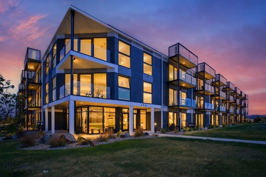 A refined top-floor residence offering modern comfort and effortless lock-and-leave living—equally suited as a full-time home, weekend retreat, or investment opportunity. Thoughtfully designed, this 1-bedroom, ¾-bath condo spans approximately 648± sq. ft. and features a seamless open-concept layout connecting the living, dining, and kitchen spaces—ideal for both entertaining and everyday living.

Expansive Euro-style windows and sliding glass doors fill the home with natural light and lead to a covered balcony, creating a bright, inviting atmosphere with a true indoor-outdoor connection. Elevated finishes include LVT flooring, quartz countertops, stainless steel appliances, and the added convenience of an in-unit washer and dryer.

The bathroom is appointed with a modern Bluetooth LED mirror, while custom window coverings and energy-efficient LED lighting enhance both comfort and design. Built in 2017, Talbach House offers secure lobby access, elevator service, and thoughtfully curated amenities, including a fully equipped fitness center and dedicated yoga studio.

The residence also includes an assigned covered carport space for off-street parking. HOA dues of $300/month provide exceptional ease of ownership, covering exterior maintenance, snow removal, and landscaping.

Ideally located just minutes from Montana State University, downtown Bozeman, dining, parks, and extensive trail systems, this property delivers both convenience and lifestyle. Unit 317 at 476 Enterprise Blvd presents a compelling opportunity to own a well-appointed, low-maintenance residence in one of Bozeman’s most accessible locations.