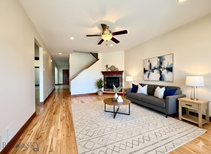 Welcome to this well-kept 4-bed, 2-bath condo with more than 2,000 sq. ft. in the sought-after White Mountain community. The main floor features a primary suite along with two additional bedrooms for convenient, single-level living. Upstairs, a versatile bonus room with closets offers plenty of options—whether as a home office, fitness space, or extra bedroom.

Highlights include hardwood floors, fresh paint, a cozy gas fireplace, and central A/C with ceiling fans for year-round comfort. The open kitchen features a gas range and flows into a bright dining and living area, perfect for gatherings. A spacious laundry/mudroom and oversized two-car garage with a utility sink add everyday convenience.

Outside, enjoy a landscaped yard, private entrance, and reserved parking. HOA covers exterior maintenance, lawn care, and water/sewer—keeping life simple.

Located close to Gallatin High, 100-Acre Park, shopping, and dining, this condo blends comfort, convenience, and value in one of Bozeman’s most central neighborhoods.