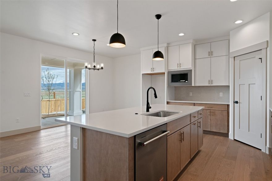 Welcome home! Feel the immediate warmth and charm of this meticulously designed 1,927 sq. ft. residence the moment you step inside. This home perfectly balances comfort and modern living, offering an inviting atmosphere where you can truly unwind after a long day. Key Features: Spacious Living: A bright, open floor plan flows seamlessly, bathed in natural light and ideal for entertaining or daily life. Comfortable Accommodations: Features three full-size bedrooms and 2.5 bathrooms, providing ample space for everyone. Outdoor Enjoyment: Step onto your private covered patio to enjoy the outdoors in style with an incredible, unobstructed view of farmland and mountains.   Added Convenience: A two-car garage provides generous storage space, and the unique back yard access means no immediate back neighbor for enhanced privacy. This property is not just a house; it's a lifestyle upgrade. Come experience this exceptional home and community today.  Check out the photo gallery for unique features in each room.