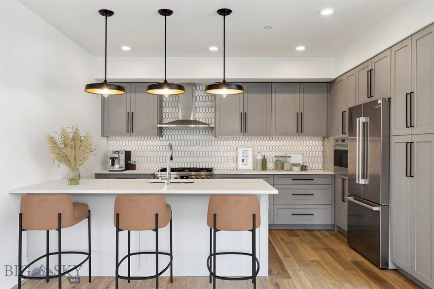 Light and bright, this South East facing unit in The Henry, a six-story luxury condominium building in Downtown Bozeman, #308 has a bright and airy feel to it. Sitting on over 1,439 SF with two bedrooms, and two bathrooms, and a 96+- sf heated balcony, this unit has it all. With engineered oak hardwood floors, wool carpeting, quartz countertops and Bosch appliances to go with high-end fixtures and tons of natural light, this condo is a ready-made luxury offering in the heart of the Rocky Mountains’ coolest town. And it doesn’t stop there - The Henry building has amenities that make it more than just a residence: a ground floor fitness center, a private, landscaped courtyard and climate-controlled, secure underground parking. Just three blocks from Main Street, twenty-five minutes to Bridger Bowl and forty-five minutes to Big Sky Resort, you'll have easy access to the vibrant downtown scene, outdoor recreational activities, and Montana's stunning natural landscapes