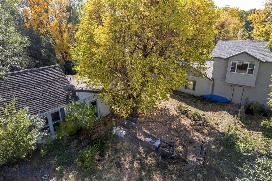 This unique property offers two homes on four spacious lots, providing an exceptional opportunity for investment or multi-generational living. Nestled on Livingston’s east side, both homes are surrounded by mature trees and have ample off street parking. The larger home at 124 South M Street is a charming 2-bedroom, 2-bathroom residence that was upgraded and expanded in 2007, offering modern conveniences with plenty of space. It also includes an attached double garage, providing ample parking and storage. The second home at 126 South M Street is a cozy 2-bedroom, 1-bathroom house, originally built in 1920, brimming with historic character. With thoughtful placement on the property, each home enjoys its own privacy, and the expansive yard enhances the feeling of space. This property has easy access to the hospital river trail, is easily walkable to downtown and only a couple minutes walk to Neptunes brewery.
