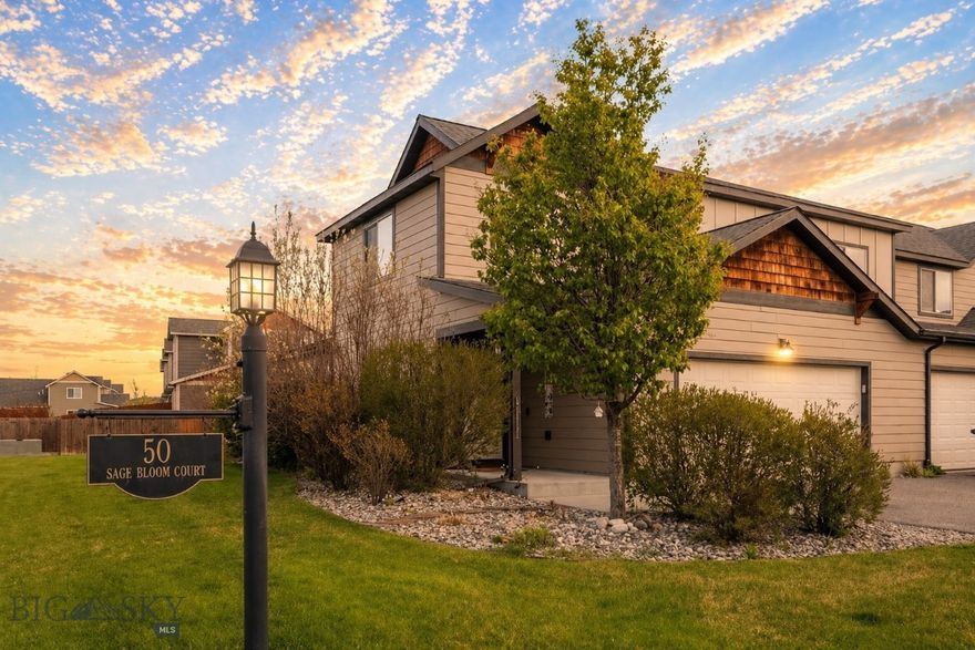 Welcome to 50 Sage Bloom, Unit A — a bright, end-unit, two-car garage townhome-style condo nestled in Bozeman's desirable North Star neighborhood. This 1,558 SF home lives large with thoughtful design and family-friendly living. The main level opens to an inviting living and dining area filled with natural light, flowing seamlessly into the updated kitchen — outfitted with new appliances in 2025 — arranged for both everyday use and relaxed entertaining. One of the best features of this home is the main floor primary bedroom, complete with new wood flooring installed in 2025 and the convenience of main-level laundry. Upstairs, you'll find two generously sized bedrooms and a full bath providing comfortable space for family, guests, or a home office, all with new carpet installed in 2026. Outside, enjoy a fenced-in backyard as well as a large side lawn with underground irrigation — offering plenty of space to relax, play, or let the pets roam. As an end unit, added privacy and an abundance of natural light come standard. Steps from Quail Run Park — complete with a playground, pavilion, and full-court basketball — and surrounded by miles of walking trails, this home puts outdoor recreation right at your doorstep. Combined with the highly sought-after Monforton school district, this is a rare opportunity for families and those seeking the best of Bozeman living. About ten minutes to downtown Bozeman, five minutes to the Gallatin River, and roughly forty minutes to Big Sky — this turnkey condo offers the perfect balance of comfort, convenience, and the Montana lifestyle. Contact us today to schedule a private showing.