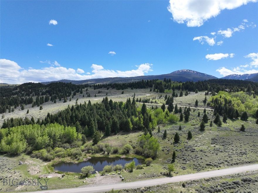 Introducing Lot 46A-1 in the prestigious Sun West Ranch community, located south of Ennis in Cameron Mt. This exclusive 6.87-acre parcel features a combination of level and sloping topography, with the designated home site thoughtfully nestled among aspens and evergreens, offering captivating views and fly-fishing opportunities on a stocked spring-fed pond on adjacent ranch open space. This homesite is designed for a single-level home and the seller has a detailed drawing available for prospective buyers. With only 55 homesites on the expansive 2000-acre ranch, that features 3 miles of the renowned blue-ribbon Madison River, Lot 46A-1 provides a rare opportunity for those seeking an exceptional Montana mountain lifestyle. For equestrian enthusiasts, the ranch offers a dedicated area to house and care for horses, ensuring convenience for owners who may be away. Miles of trails for hiking, skiing, horseback riding, or mountain biking crisscross the ranch and connect to thousands of acres of adjacent public land. This lot has undergone a thorough geotechnical study and possesses a comprehensive topographic survey. Each parcel is equipped with water, power, electricity, and fiber optics at the lot line, ensuring modern amenities in this rustic setting. Sun West Ranch, a gated community with 24/7 onsite management, guarantees security and peace of mind. Experience the essence of Montana living in one of the last best places where a conservation mindset harmoniously meets the western lifestyle amidst the rugged beauty of the Montana mountains. This carefully planned ranch affords privacy and space for owners, allowing the seamless movement of elk and other wildlife across the ranch's diverse landscape, bridging the river, ponds, and public lands. Don't miss your chance to be a part of this unparalleled opportunity in Sun West Ranch.