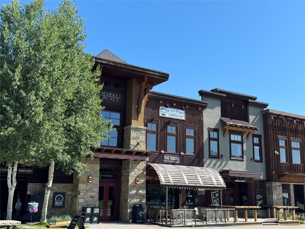 A COMMERCIAL MARKET PLACE CONDOMINIUM LOCATED IN THE HEART OF TOWN CENTER JUST OFF OF OUSEL FALLS ROAD, WITH A PREMIER LOCATION.
Located above the Rocks Cafe, this commercial unit is 966 square feet, with beautiful wood floors and large windows overlooking the Town Center Firepit and heart of local events.  Lots of parking in back of building and front streetside.  Modern interior in neutral tones, air-conditioning, and elevator access provide a welcoming atmosphere.  Within walking distance of many restaurants, shopping, banks, sports gear rental and Big Sky Arts center and galleries.   Excellent centralized location and modern convenience.
